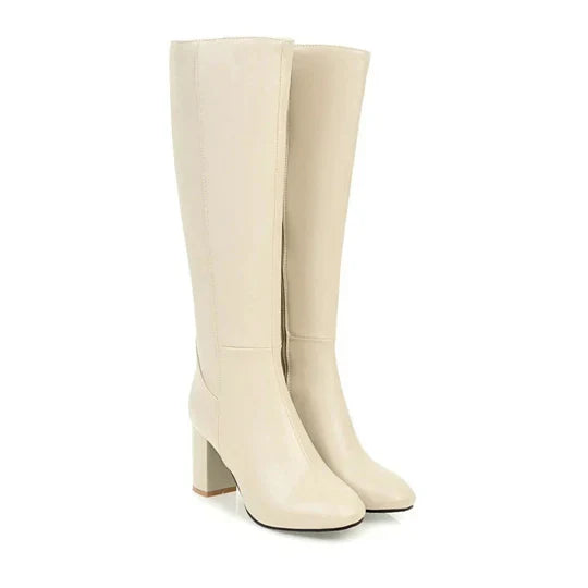 Kniehohe Stiefel mit Absatz und Reißverschluss für Damen. Elegantes Design trifft auf alltäglichen Komfort.