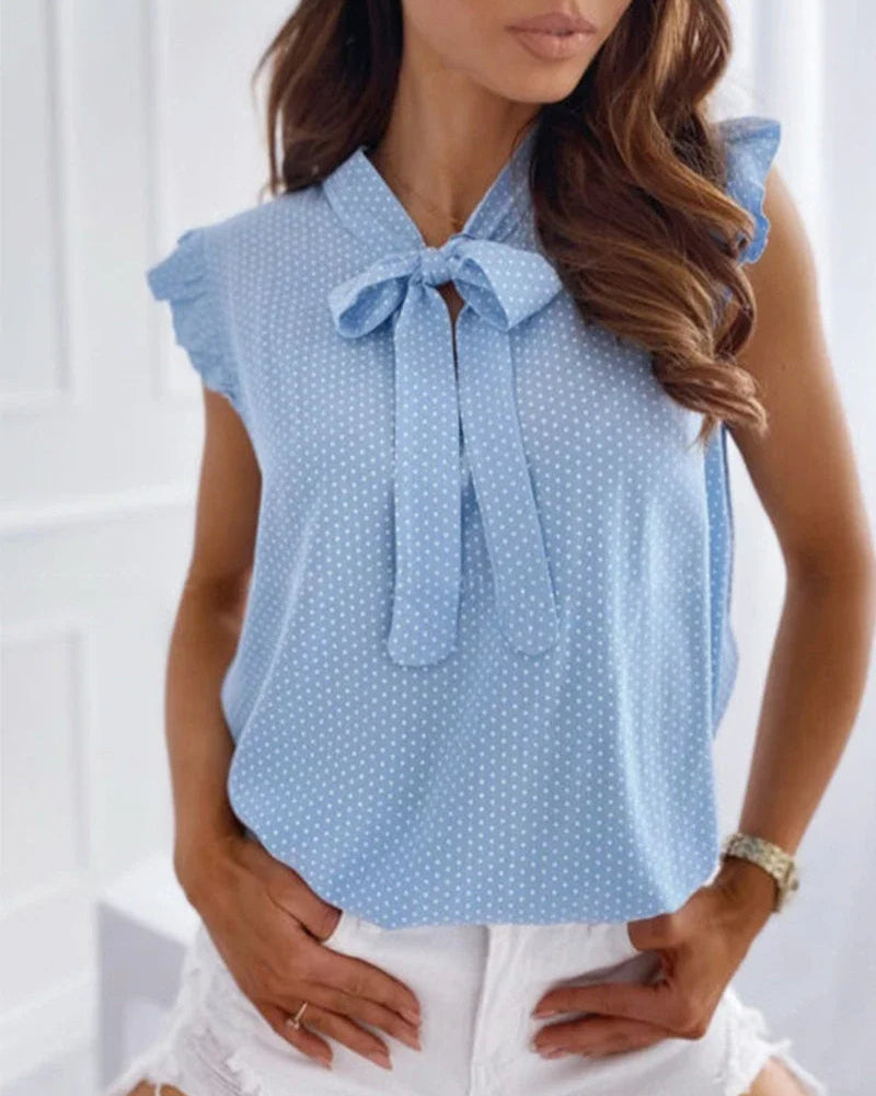 Elegante ärmellose Bluse mit Rüschen und Schleifendetail