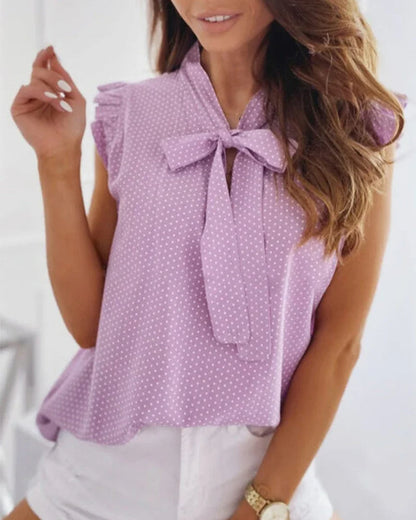 Elegante ärmellose Bluse mit Rüschen und Schleifendetail
